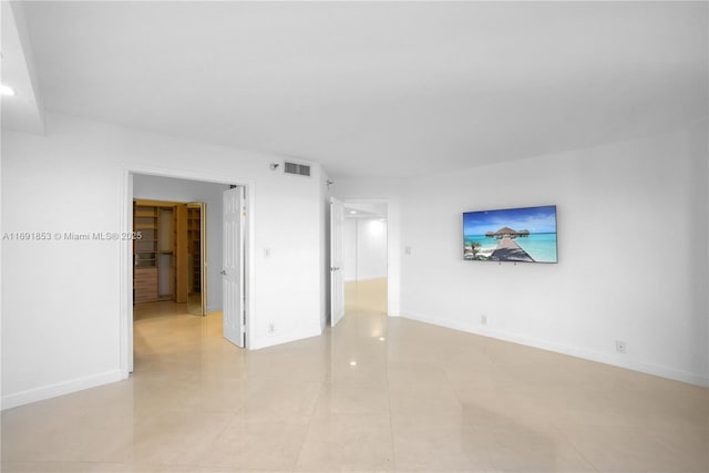 unfurnished room featuring light tile patterned flooring