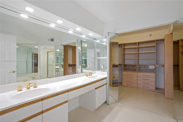 bathroom with tile patterned flooring and vanity