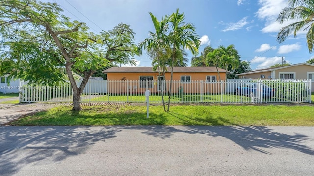 ranch-style home with a front yard