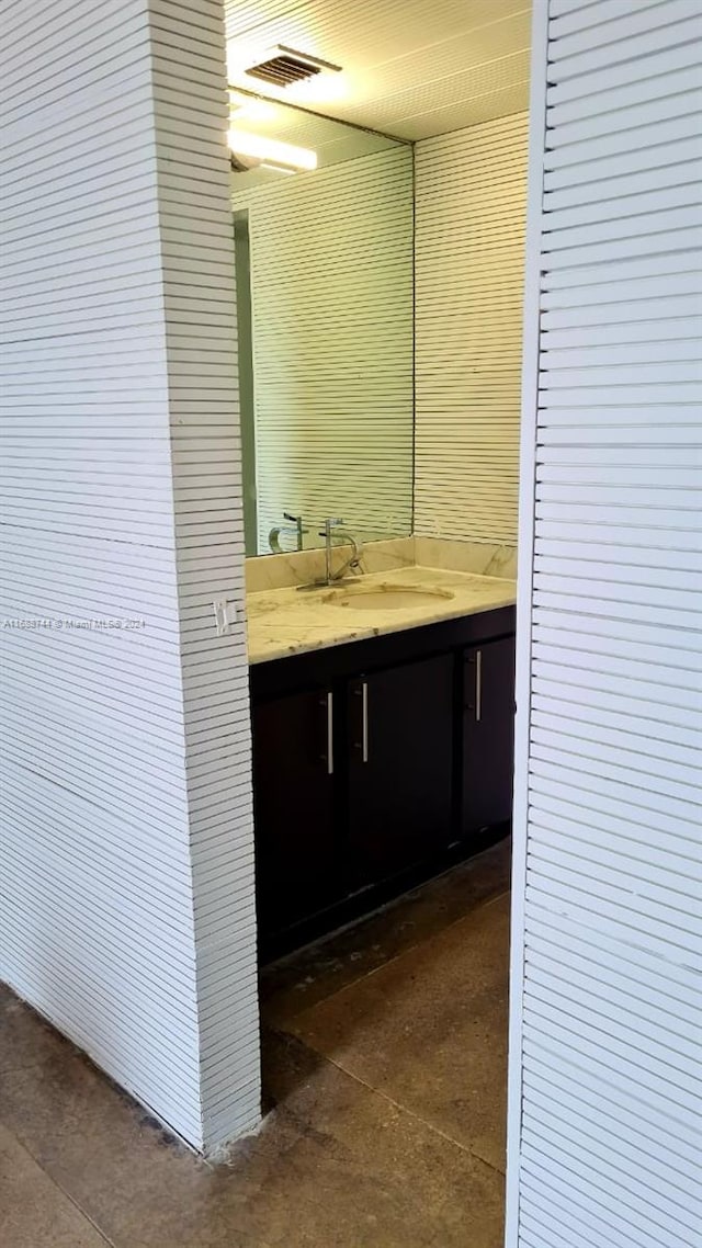 bathroom featuring vanity and concrete floors