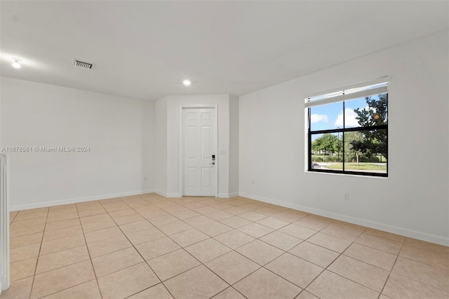 empty room with light tile patterned flooring