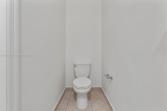 bathroom featuring toilet and tile patterned floors