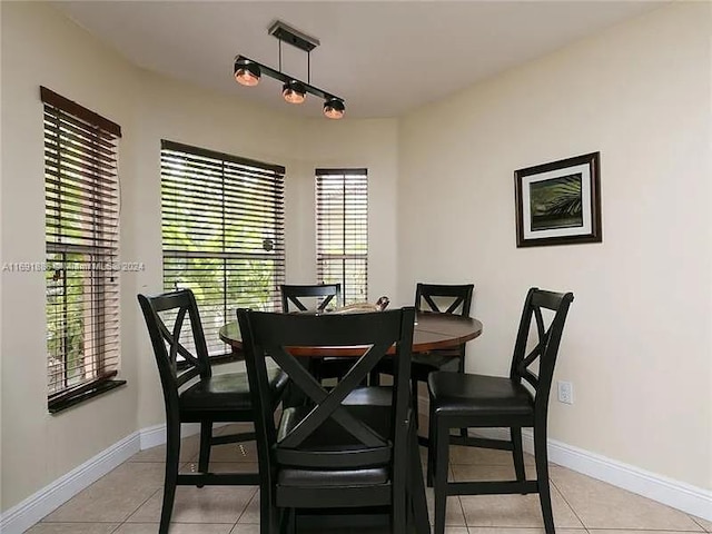 dining space featuring light tile patterned floors