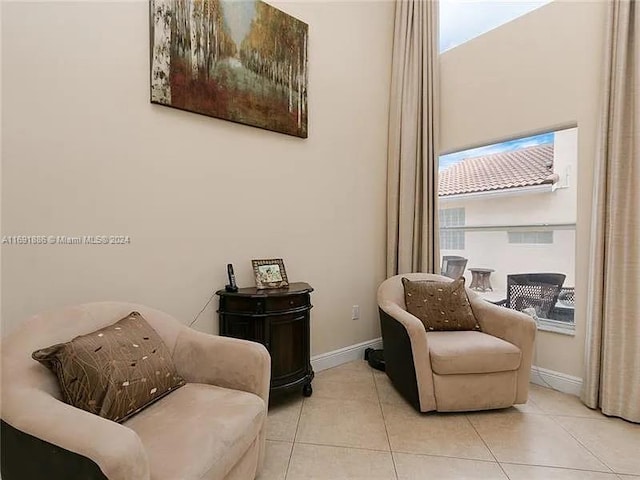 living area with light tile patterned floors