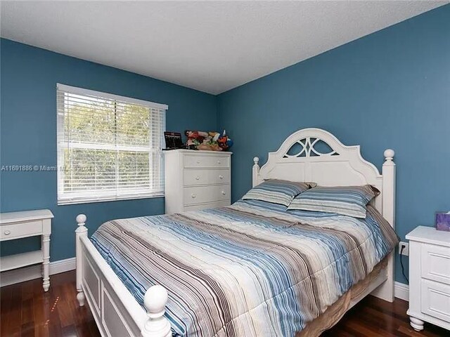 bedroom featuring dark hardwood / wood-style floors