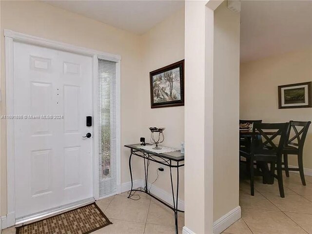 foyer with light tile patterned flooring