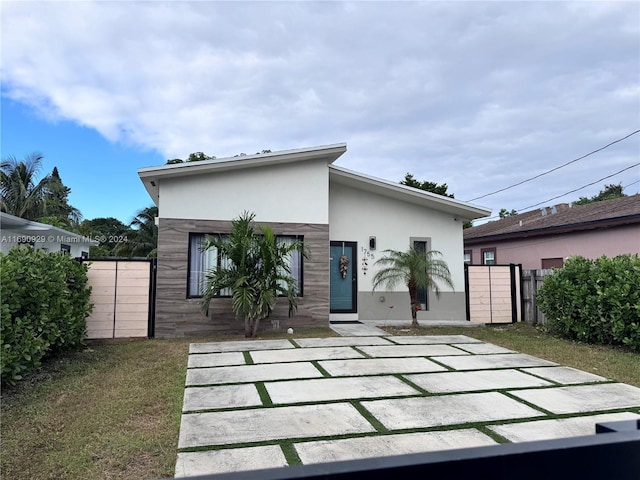 rear view of house with a patio