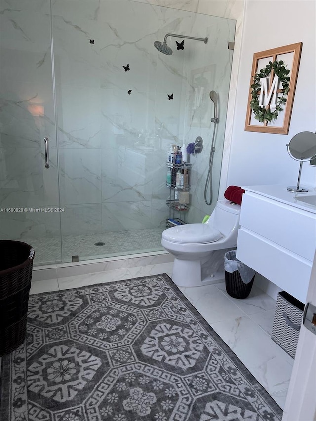 bathroom with vanity, toilet, and an enclosed shower