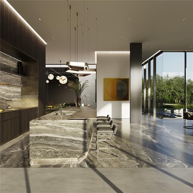 kitchen with concrete flooring and dark brown cabinets