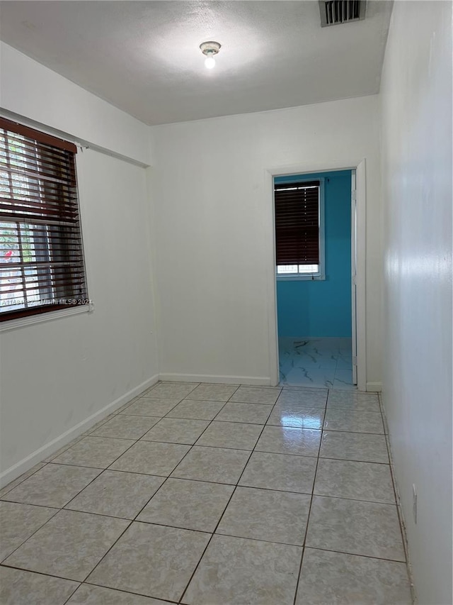 view of tiled spare room