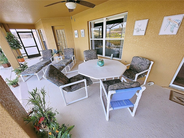 sunroom with ceiling fan