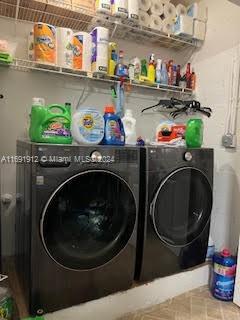 laundry area with washer and clothes dryer