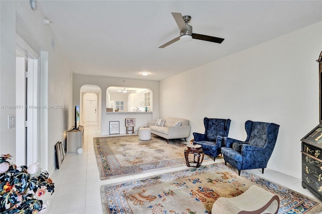 tiled living room featuring ceiling fan