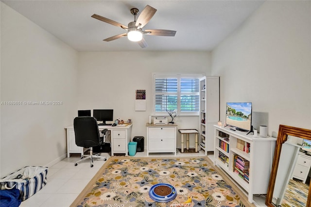 office with light tile patterned floors and ceiling fan