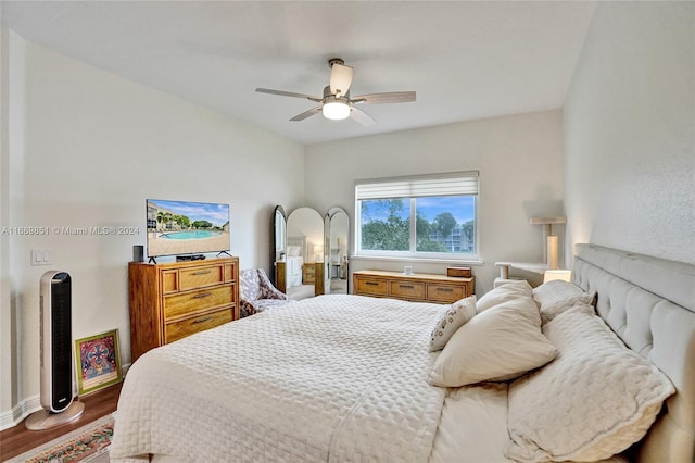 bedroom featuring ceiling fan and hardwood / wood-style flooring