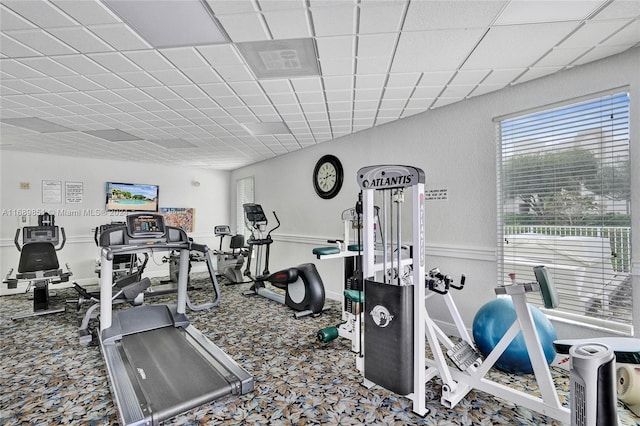 gym featuring a drop ceiling