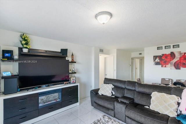 living room featuring a textured ceiling