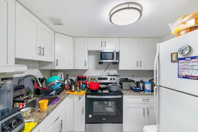 kitchen with white cabinetry, appliances with stainless steel finishes, and sink