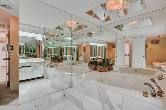 bathroom featuring vanity and a relaxing tiled tub