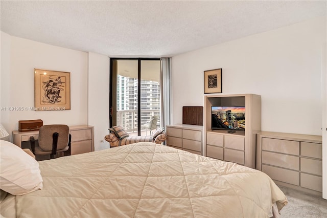 carpeted bedroom with a textured ceiling