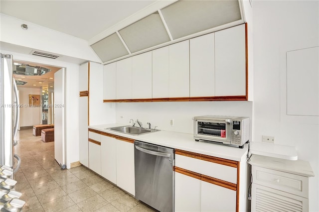 kitchen featuring sink, white cabinets, and stainless steel dishwasher