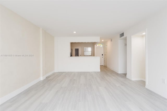 spare room featuring light wood-type flooring