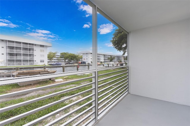 balcony featuring a water view