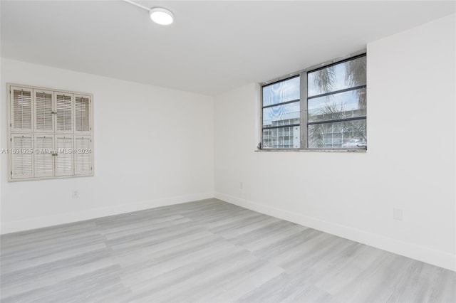 spare room featuring light wood-type flooring