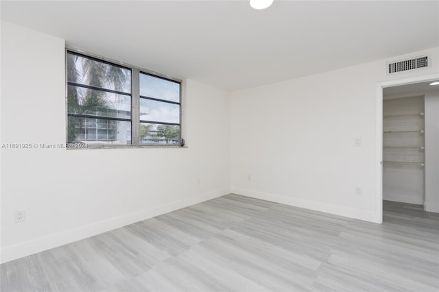 spare room with light wood-type flooring