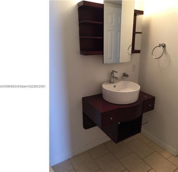 bathroom with vanity and tile patterned floors