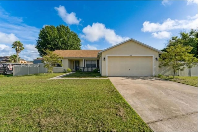 ranch-style home with a garage and a front yard