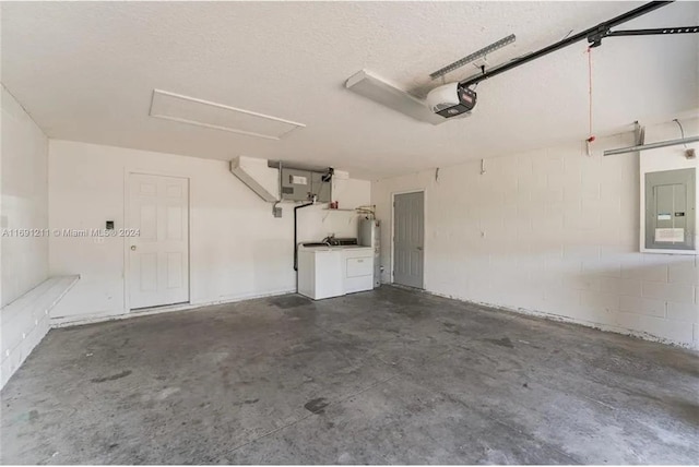 garage with electric panel, a garage door opener, and washer and dryer