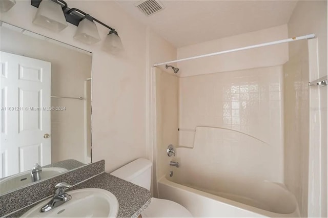 full bathroom featuring  shower combination, vanity, and toilet