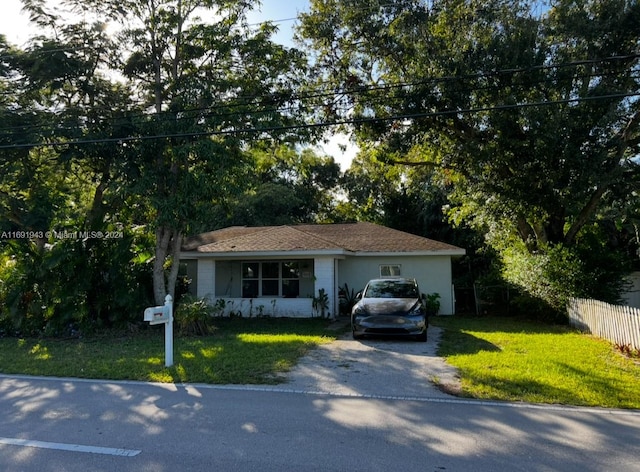 ranch-style house with a front yard