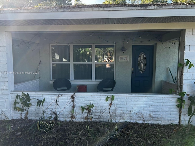 entrance to property with a porch