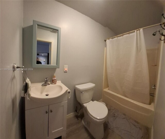 full bathroom featuring vanity, toilet, and shower / tub combo