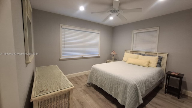 bedroom featuring light wood-type flooring and ceiling fan