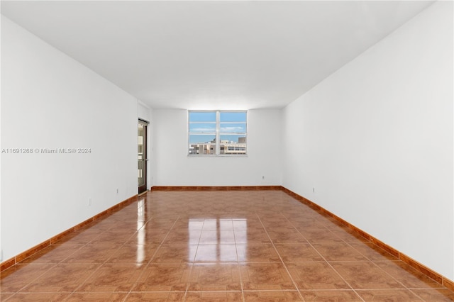 view of tiled spare room