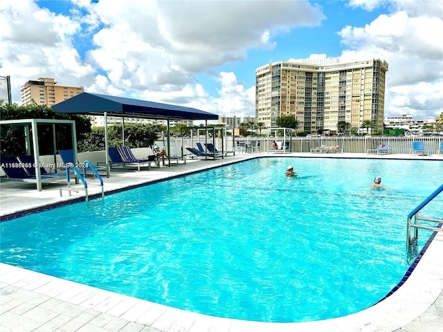 view of swimming pool featuring a patio area