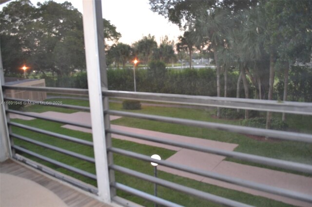 view of balcony at dusk