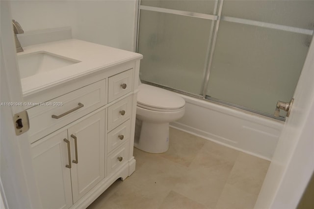 full bathroom featuring shower / bath combination with glass door, vanity, and toilet