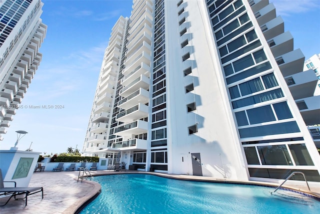 view of pool featuring a patio area