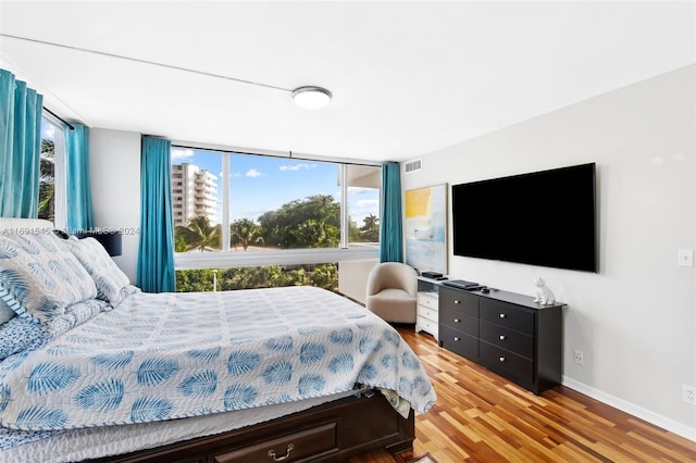 bedroom with hardwood / wood-style floors