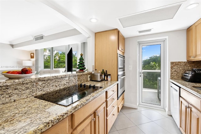 2715 N Ocean Blvd Unit 3A, Fort Lauderdale, FL 33308 - kitchen featuring appliances with stainless steel finishes, plenty of natural light, light tile patterned floors, light stone counters, and recessed lighting