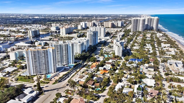 drone / aerial view featuring a view of the beach and a water view