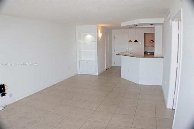 interior space featuring a textured ceiling