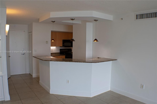 kitchen featuring black appliances, dark stone counters, decorative light fixtures, light tile patterned floors, and kitchen peninsula