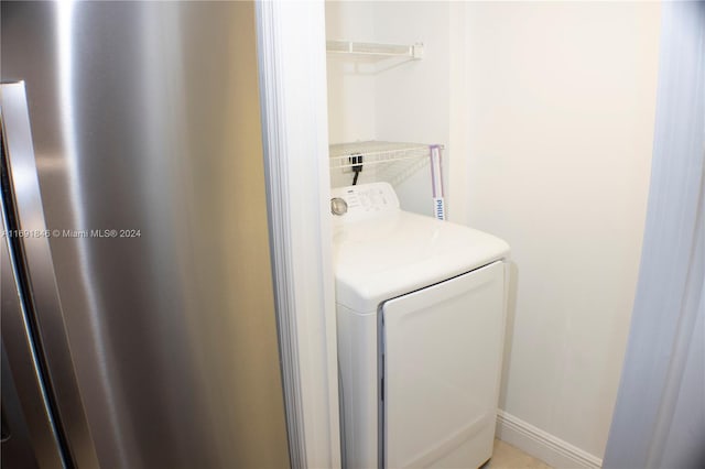 laundry room featuring washer / dryer