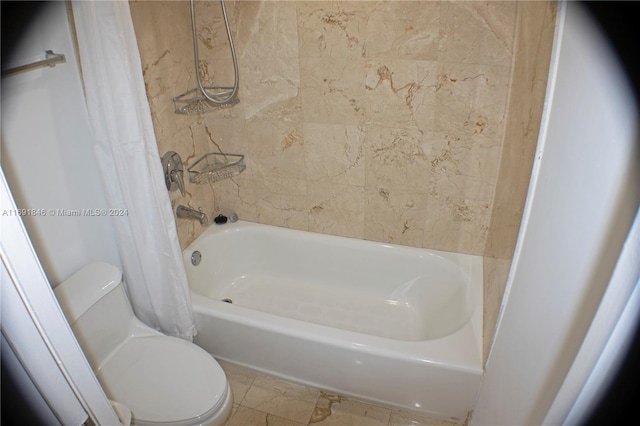 bathroom with tile patterned floors and toilet