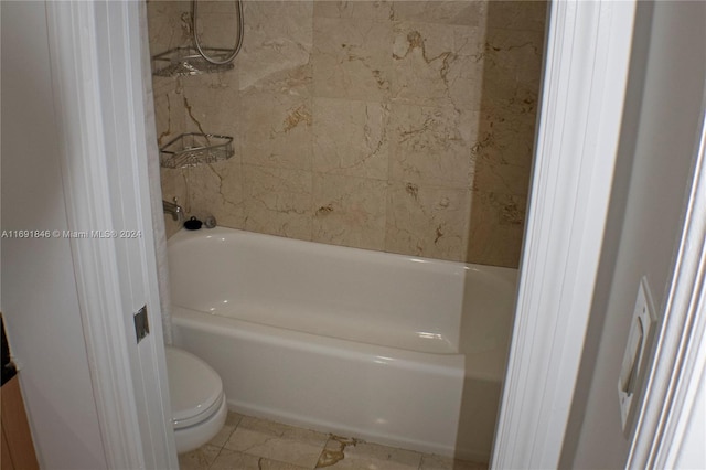 bathroom with tile patterned floors and toilet